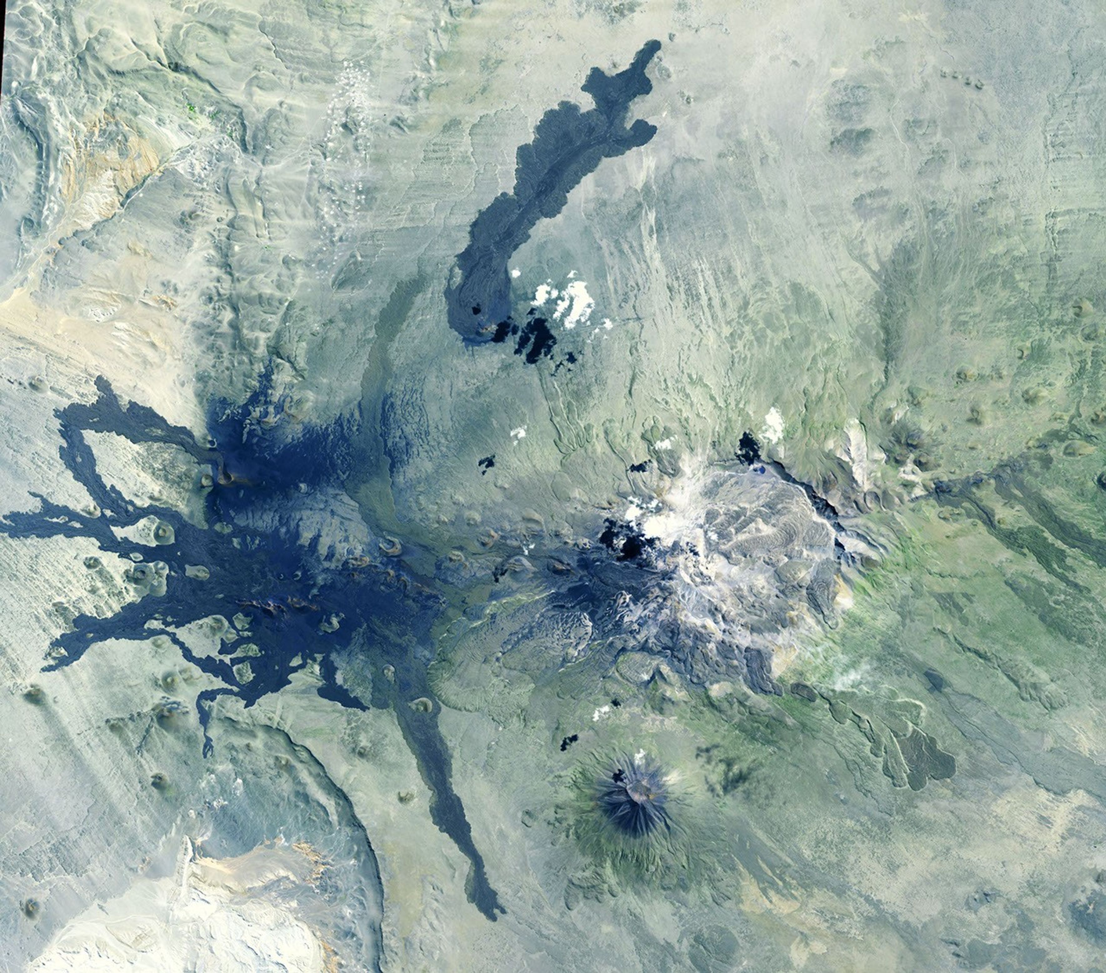 NASA's Terra spacecraft shows Payun Matru, a large shield volcano capped by a caldera, located in the Andean Volcanic Belt in Argentina.