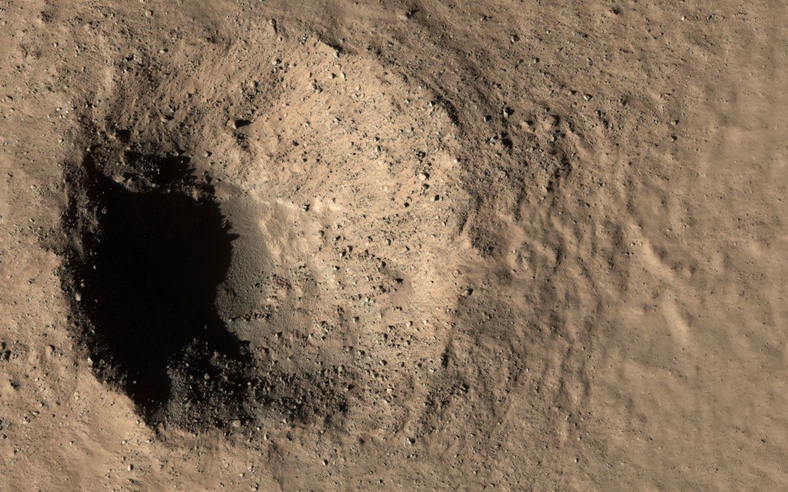 This image acquired on March 18, 2020 by NASA's Mars Reconnaissance Orbiter, shows two different targets at once, a geologically-young crater and a small even younger one.