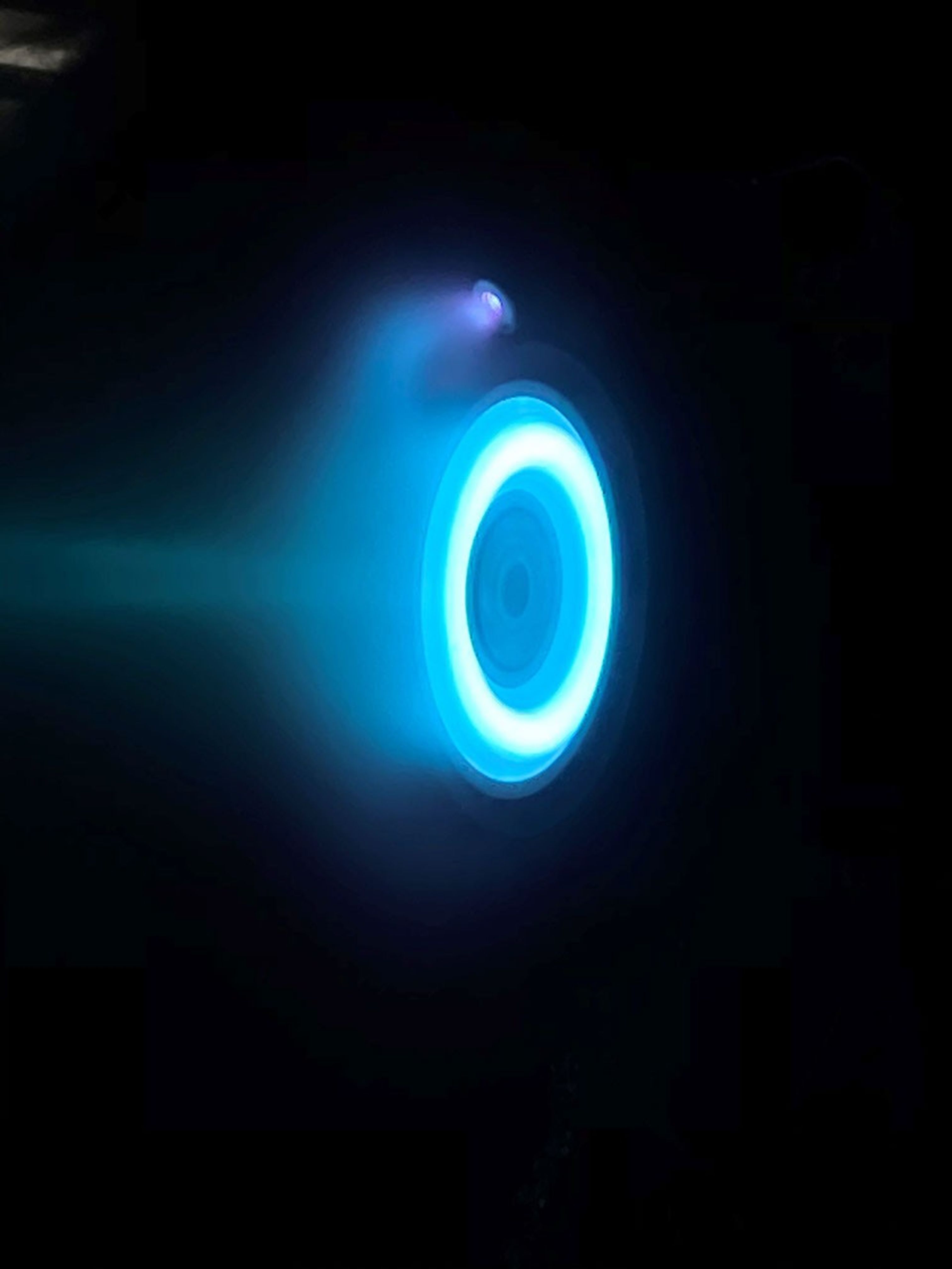 An electric Hall thruster, identical to those that will be used to propel NASA's Psyche spacecraft, undergoes testing at NASA's Jet Propulsion Laboratory.