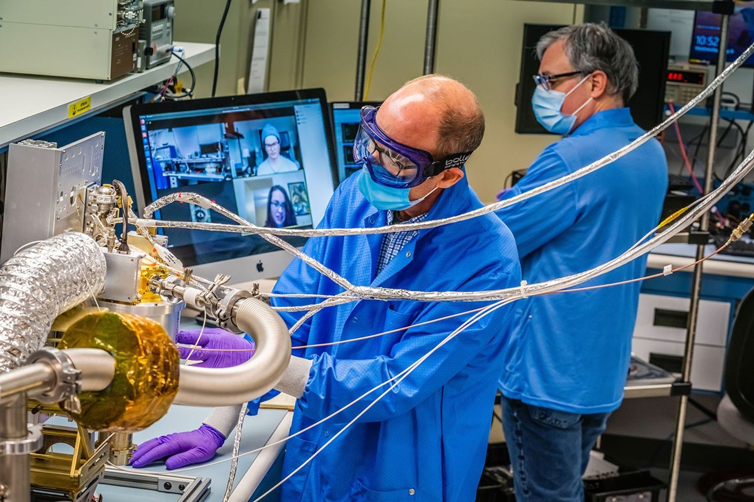 Engineers at the Johns Hopkins Applied Physics Laboratory in Laurel, Maryland, make progress on the spectrometer for NASA's Psyche spacecraft, while observing COVID-19 safety procedures.