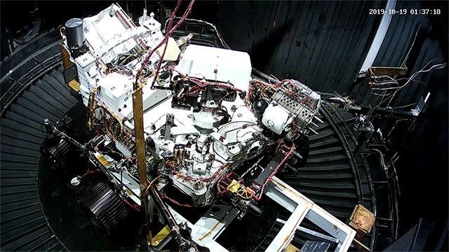 This animated GIF shows the deployment of the Perseverance rover's remote sensing mast during a cold test in a space simulation chamber at NASA's Jet Propulsion Laboratory.
