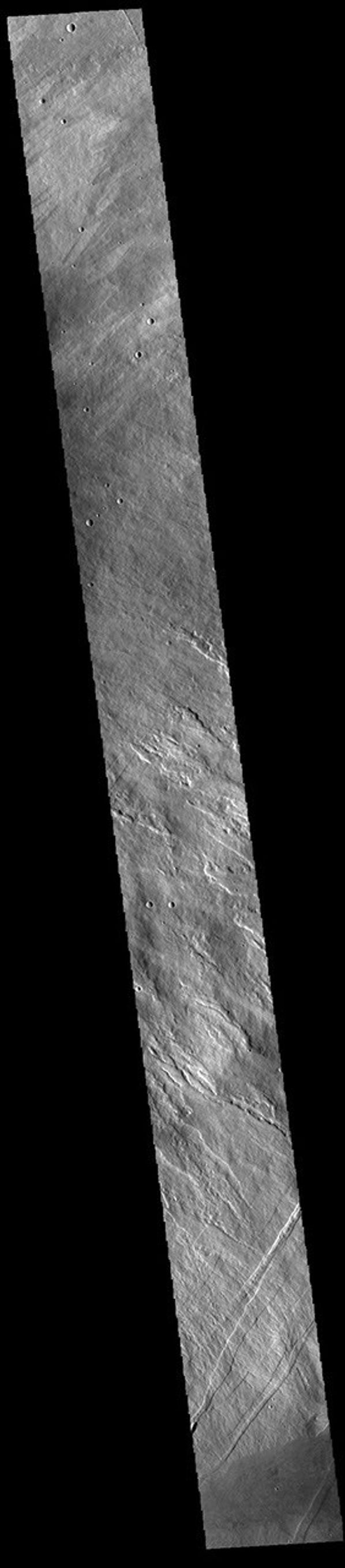 This image from NASA's Mars Odyssey shows the eastern flank of Arsia Mons, the southernmost aligned volcano in the Tharsis region.