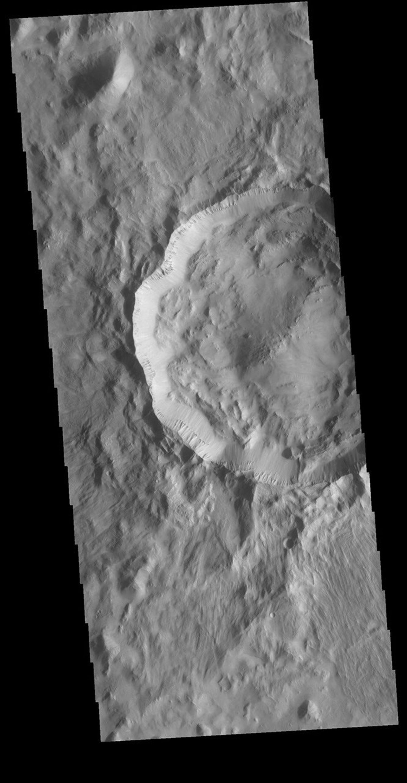 This image from NASA's Mars Odyssey shows an unnamed crater located on the boundary between Terra Cimmeria and Nepenthes Planum.