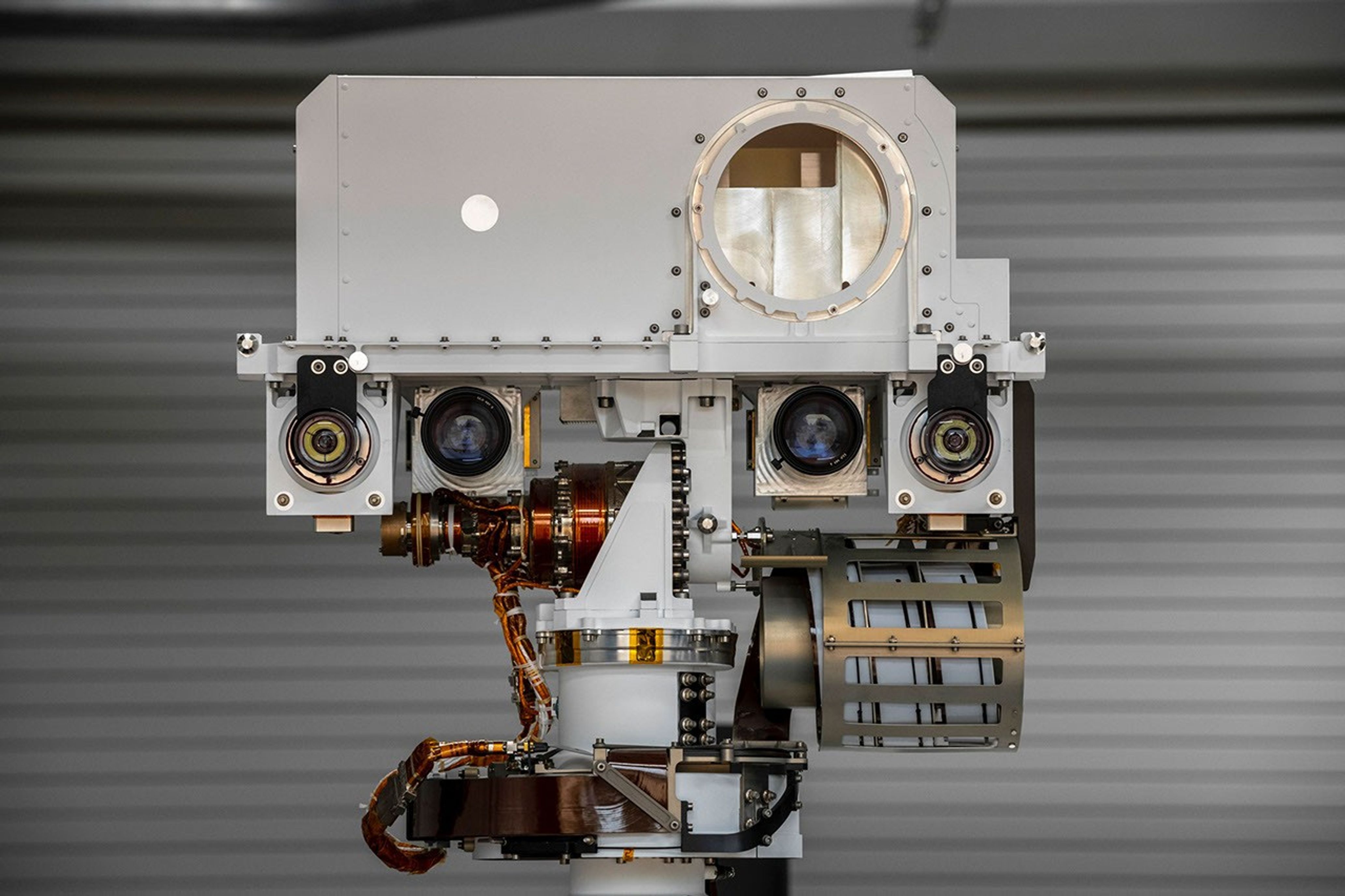 The full-scale engineering model of NASA's Perseverance rover raises its head, or remote sensing mast, at NASA's Jet Propulsion Laboratory in Southern California.