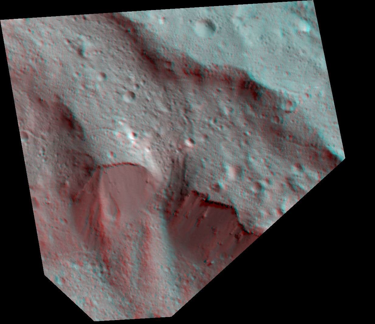 This Dawn stereo anaglyph of Occator Crater on Ceres shows impact melt deposits draped on faulted blocks on the northeastern rim of the 57-mile (92-kilometer) diameter crater.