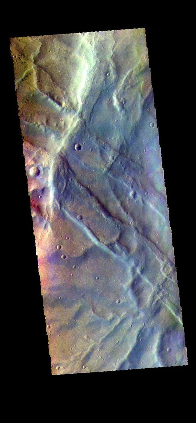 This image from NASA's Mars Odyssey shows part of Claritas Fossae. The linear features in the image are graben, formed when a block of material subsides between paired faults in a region of extensional tectonic stress.