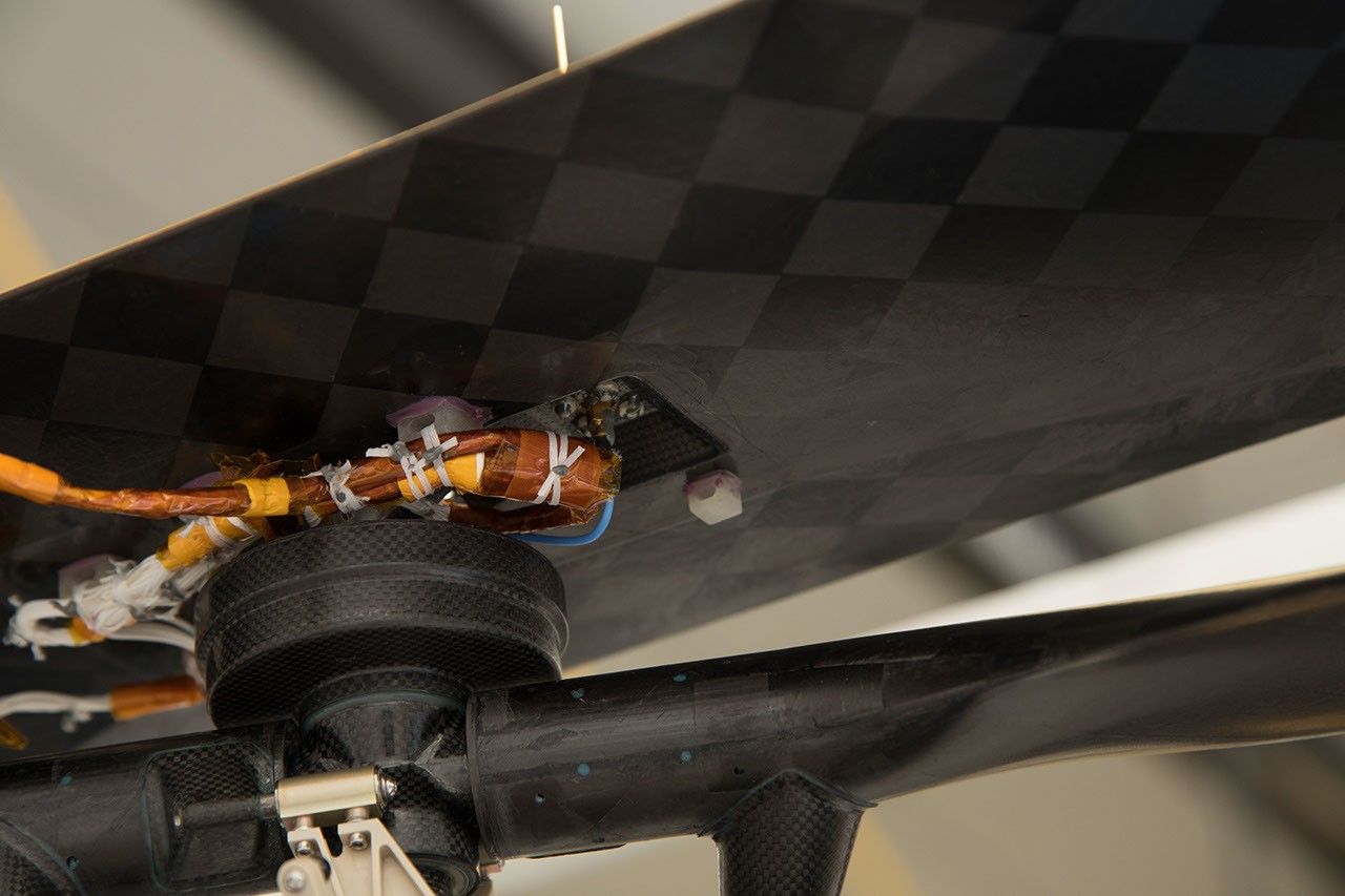 NASA's Ingenuity Mars Helicopter carries a small swatch of muslin material from the lower-left wing of the Wright Brothers Flyer 1.