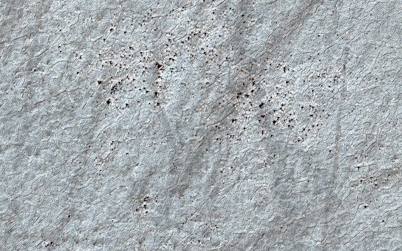 This image acquired on October 25, 2020 by NASA's Mars Reconnaissance Orbiter, shows a textbook example of regular, nearly hexagonal polygon networks.