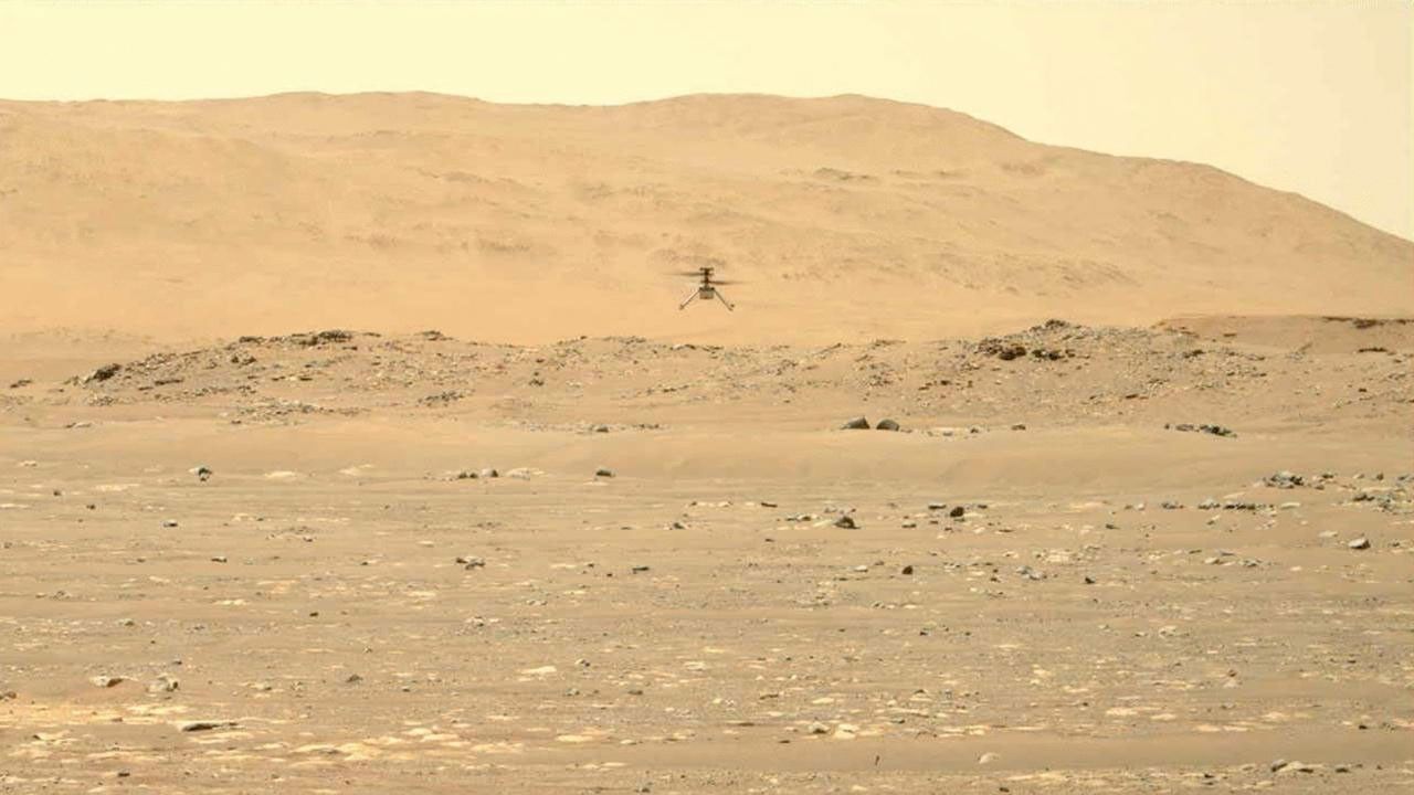 NASA's Ingenuity Mars Helicopter hovers over Jezero Crater during its second experimental flight test on April 22, 2021. The imagery was captured by the Perseverance rover's Mastcam-Z imager.