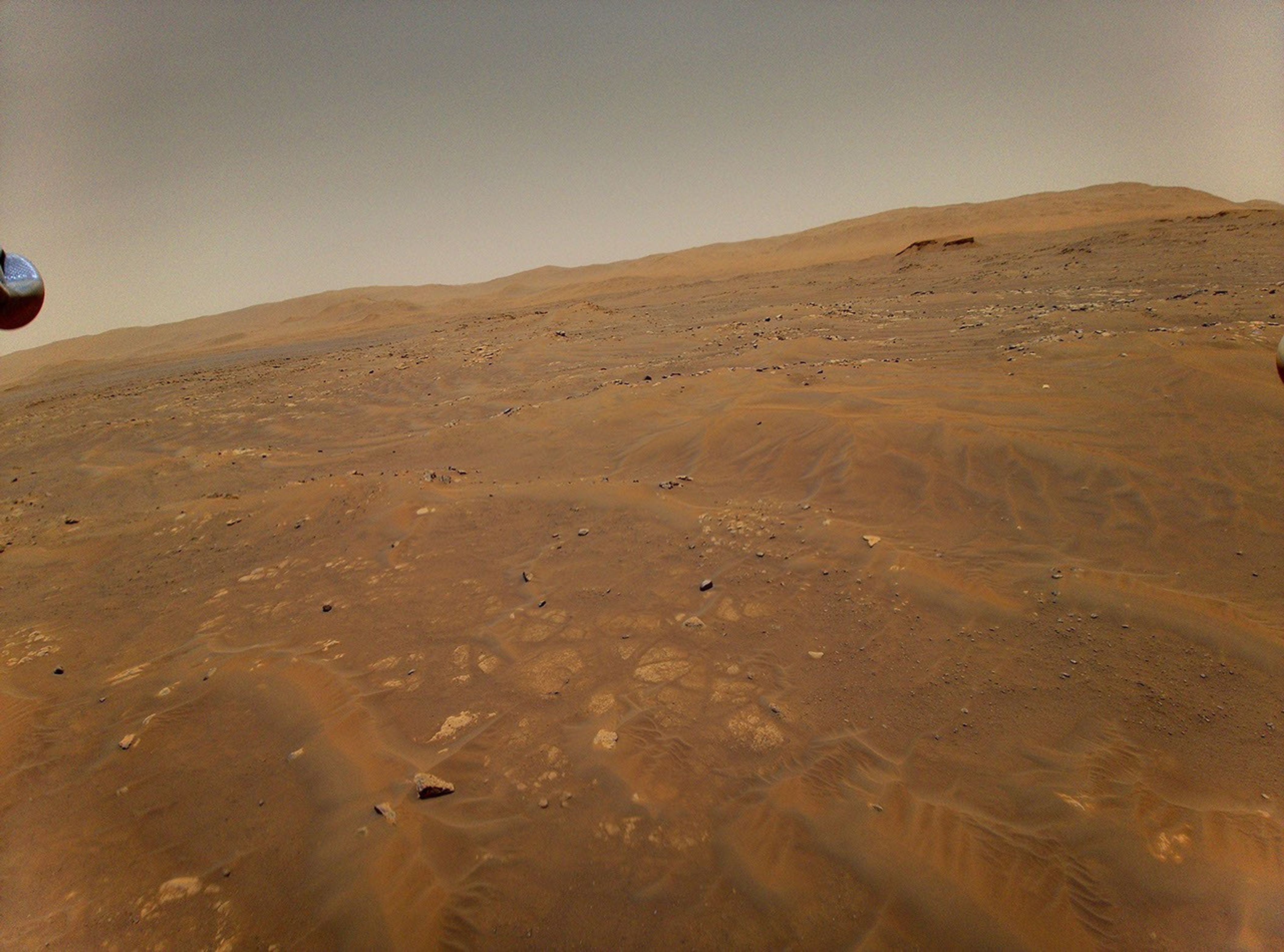 This image of Mars was taken from the height of 33 feet (10 meters) by NASA's Ingenuity Mars helicopter during its sixth flight on May 22, 2021.