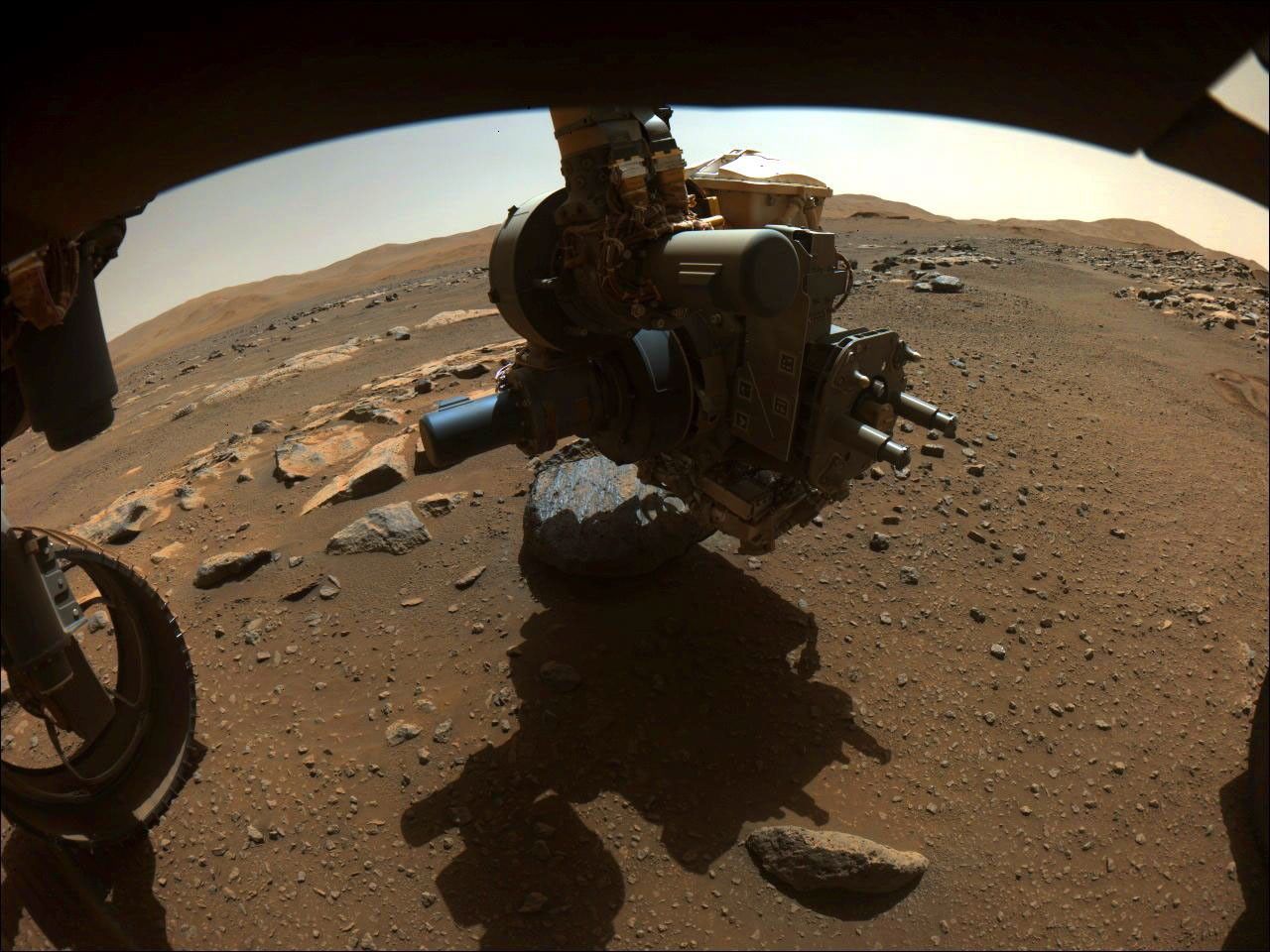 On Aug. 27, 2021, NASA's Perseverance rover captured this image of the science-instrument-laden turret at the end of its robotic arm getting close to the rock nicknamed Rochette.