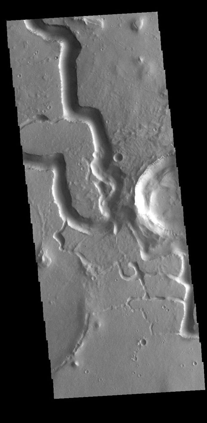 This image from NASA's Mars Odyssey shows ppart of Hephaestus Fossae, located in Utopia Planitia.