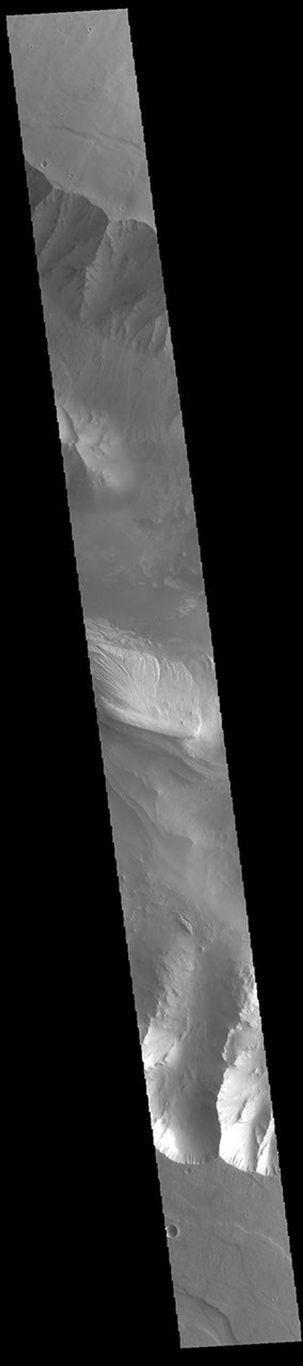 This image from NASA's Mars Odyssey shows part of eastern Candor Chasma. Candor Chasma is one of the largest canyons that make up Valles Marineris.