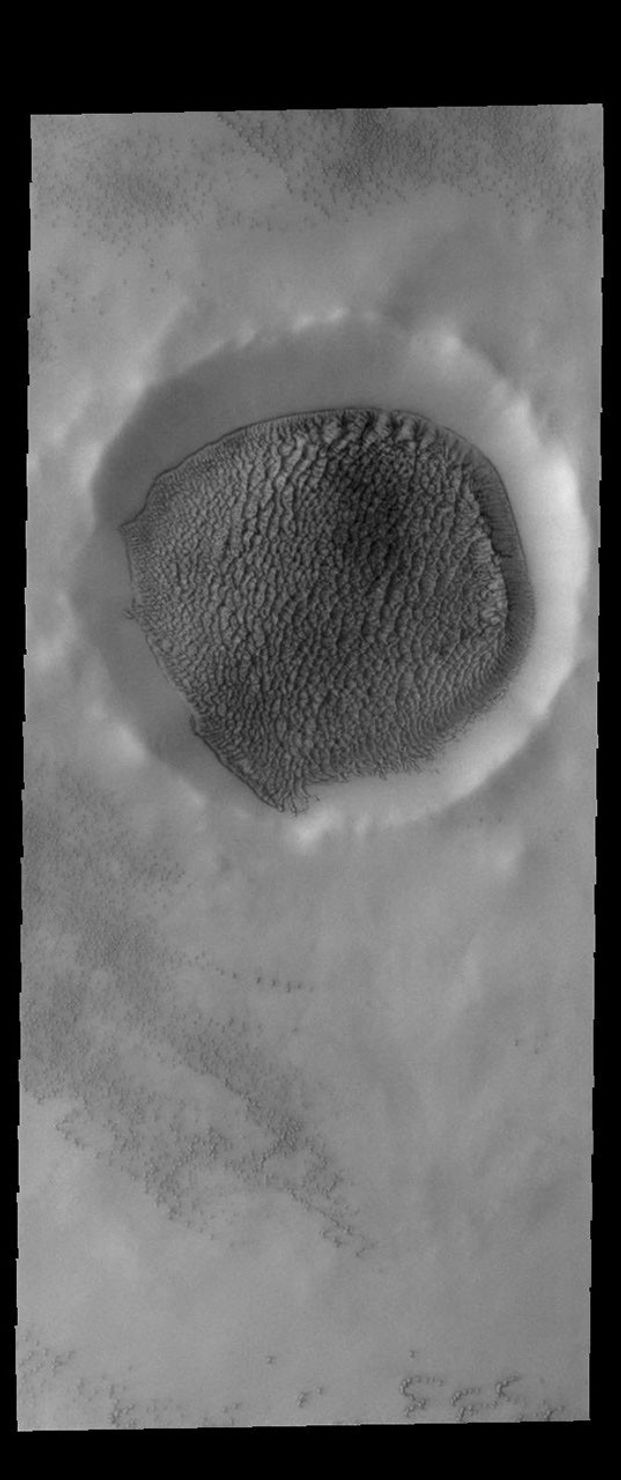 This image from NASA's Mars Odyssey shows an unnamed crater in the northern plains of Mars.