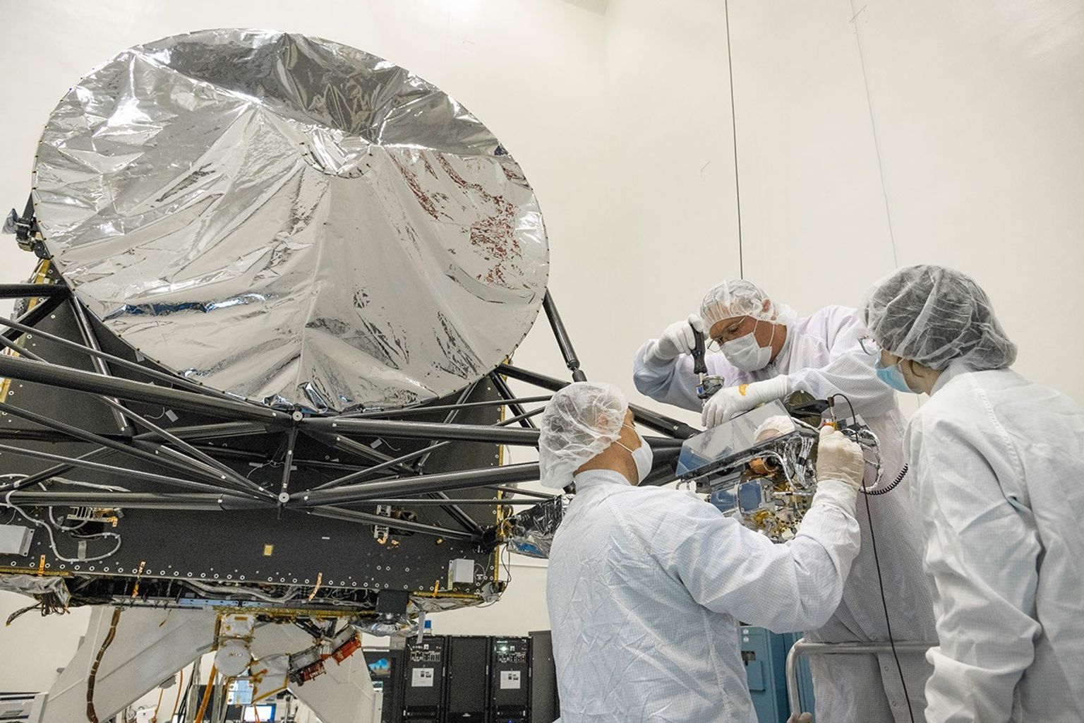 At NASA's Jet Propulsion Laboratory, engineers integrate a gamma ray and neutron spectrometer into the agency's Psyche spacecraft. The instrument will help determine the elements that make up its target, an asteroid also named Psyche.