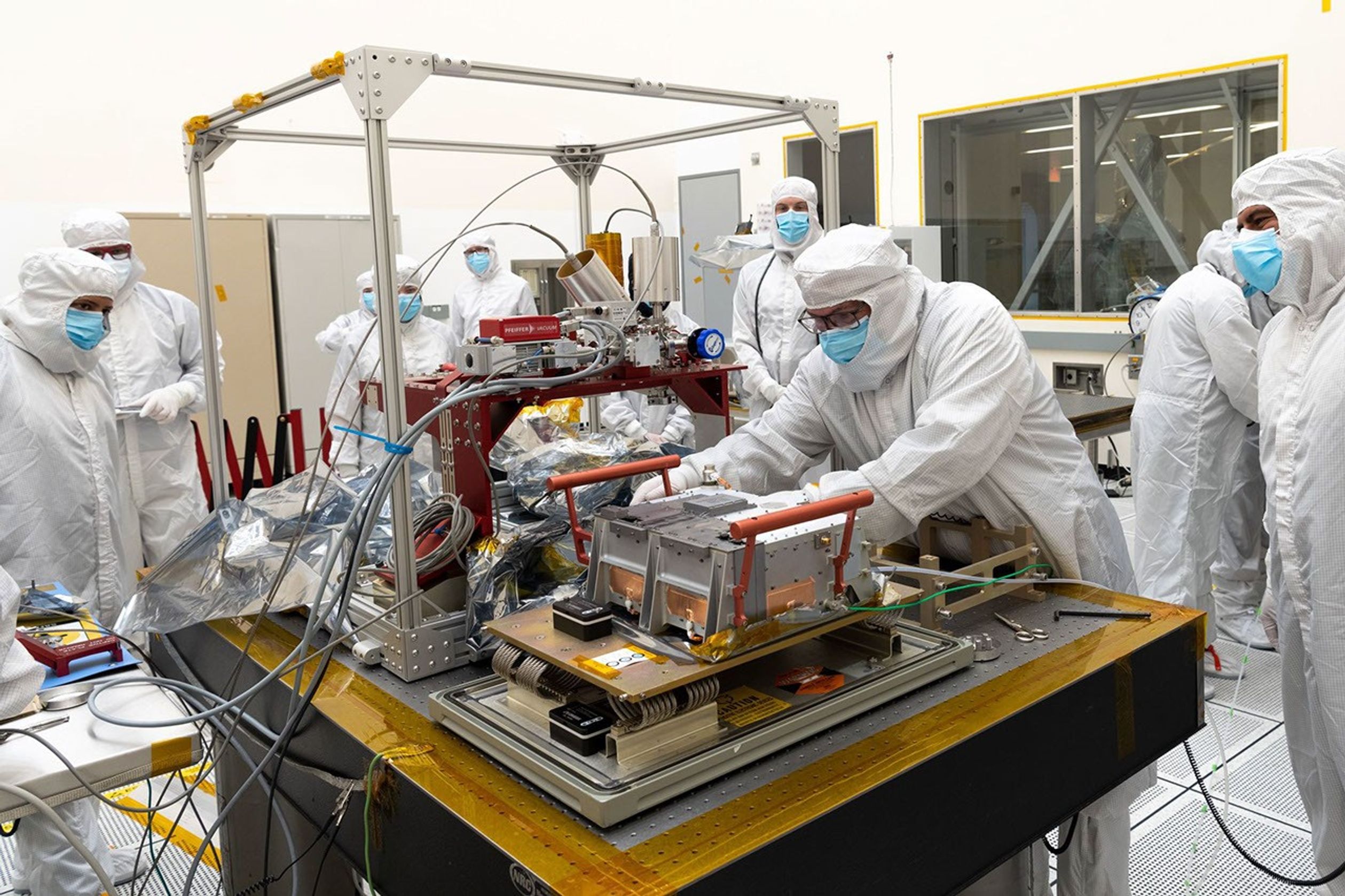 Engineers and technicians examine and test the first of NASA's Europa Clipper's science instruments to be delivered to the agency's Jet Propulsion Laboratory in Southern California.