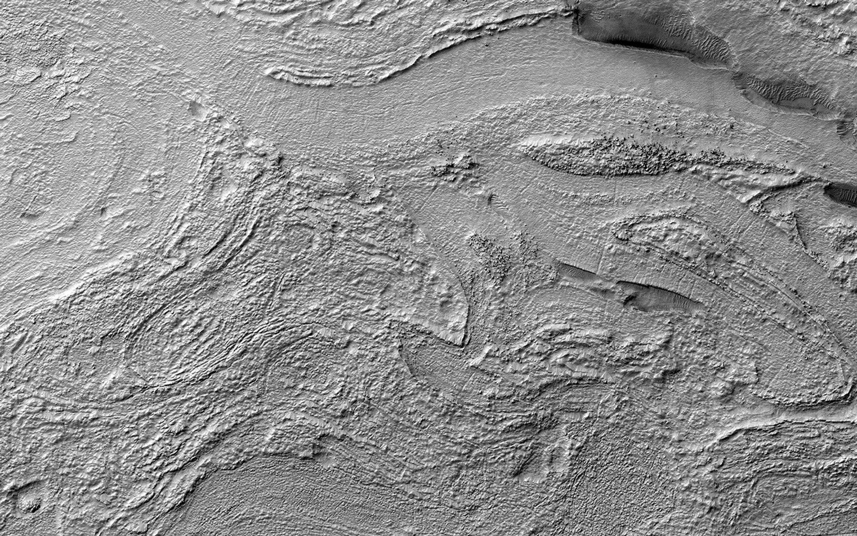 This image acquired on March 12, 2021 by NASA's Mars Reconnaissance Orbiter, shows a portion of an enigmatic formation called banded terrain, which is only observed in the northwest of the Hellas basin.