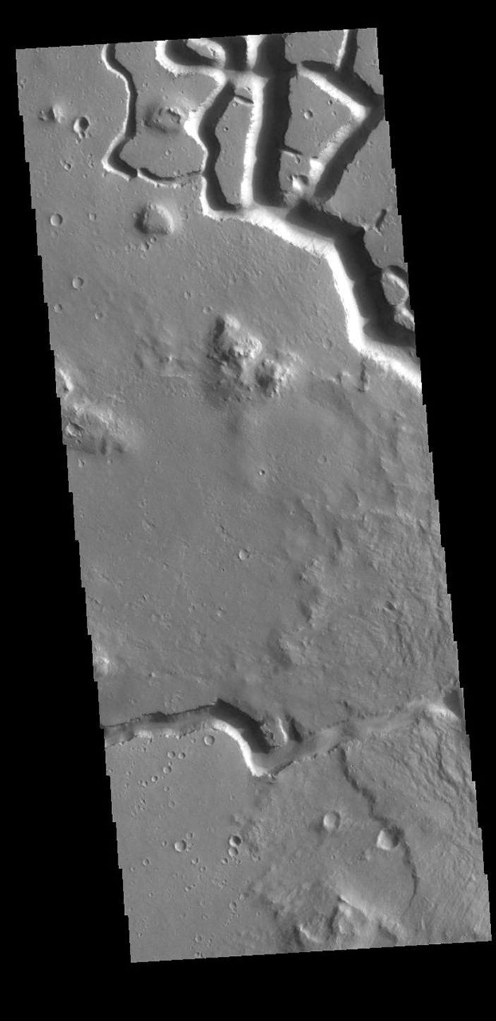 This image from NASA's Mars Odyssey shows part of Hephaestus Fossae. Hephaestus Fossae is a complex channel system in Utopia Planitia near Elysium Mons.
