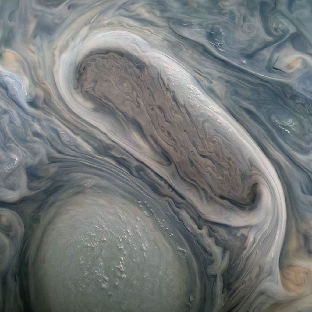 This JunoCam image shows two of Jupiter's large rotating storms, captured on Juno's 38th perijove pass, on November 29, 2021.
