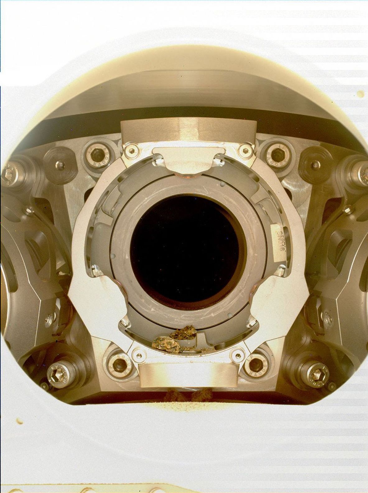 Pebble-sized debris can be seen in the bit carousel of NASA's Perseverance Mars rover in this January 7, 2022, image.