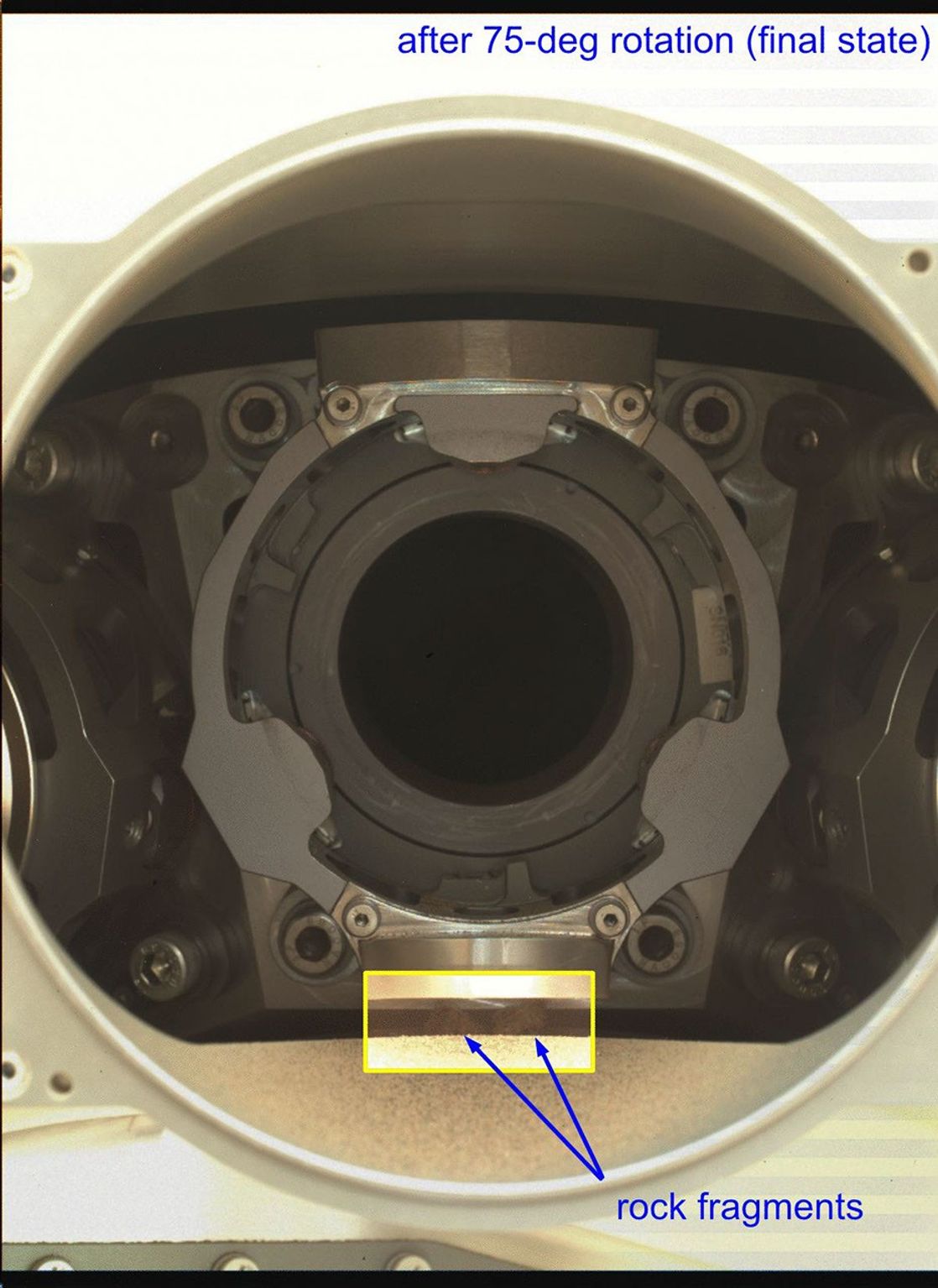 An annotated GIF depicts a rotational test of Perseverance's bit carousel in which two of four rock fragments were ejected. The five images that make up the GIF were obtained by the rover's WATSON imager on Jan. 17, 2022.