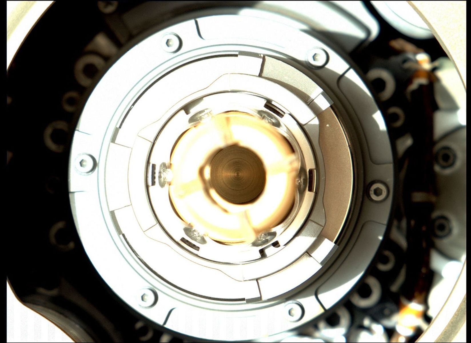 This image, taken by the Mastcam-Z camera aboard NASA's Perseverance Mars rover on Jan. 20, 2022, shows the rover successfully expelled the remaining large fragments of cored rock from a sample tube held in its drill.