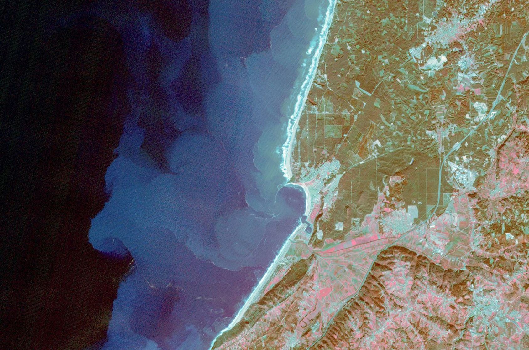 NASA's Terra spacecraft shows the village of Nazare, Portugal. Sediment highlights off-shore current patterns in the image. The image was acquired November 24, 2009.