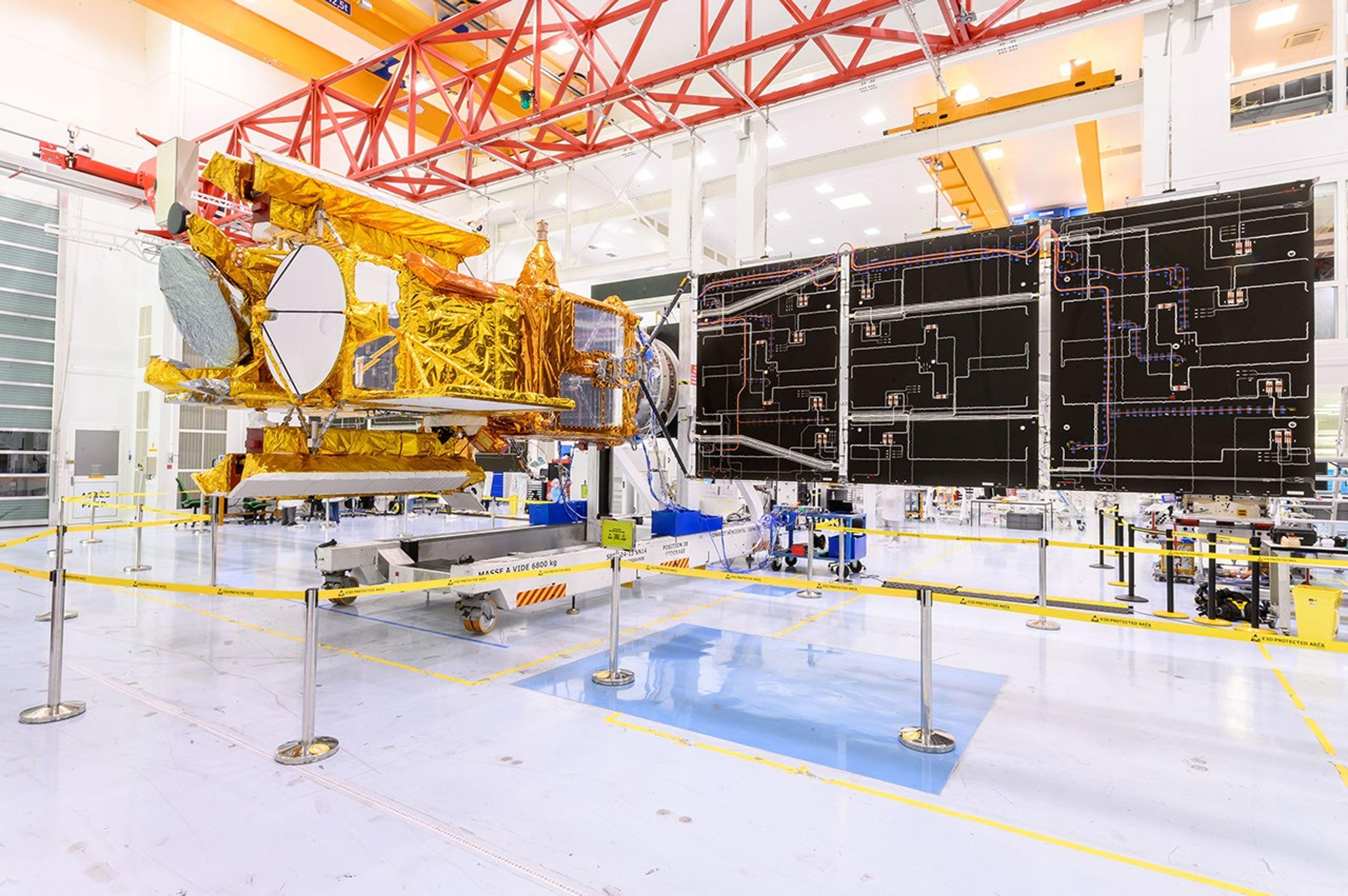 SWOT's solar panels unfold as part of a test in January at a Thales Alenia Space facility in Cannes, France, where the satellite is being assembled. SWOT will measure elevations of Earth's ocean and surface water.