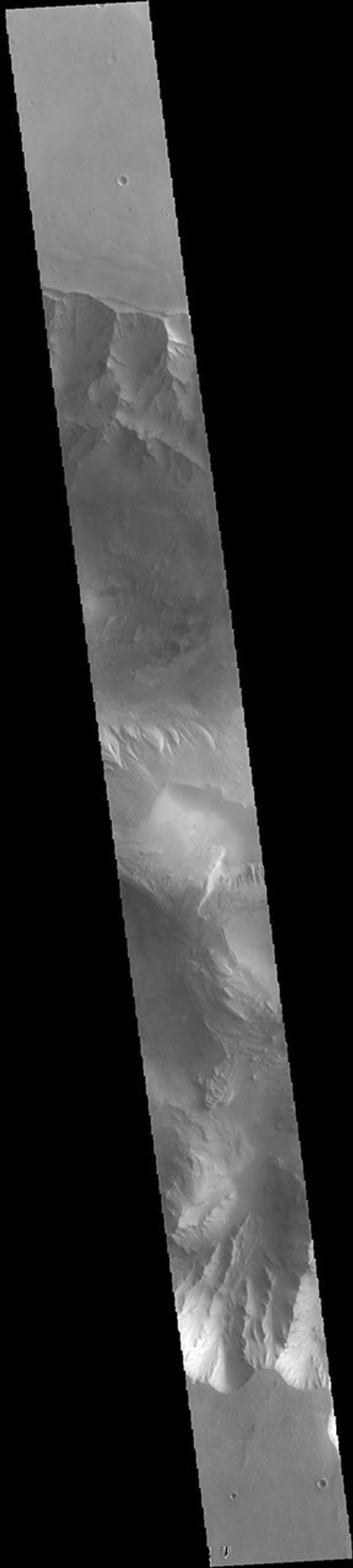 This image from NASA's Mars Odyssey shows part of eastern Candor Chasma. Candor Chasma is one of the largest canyons that make up Valles Marineris.