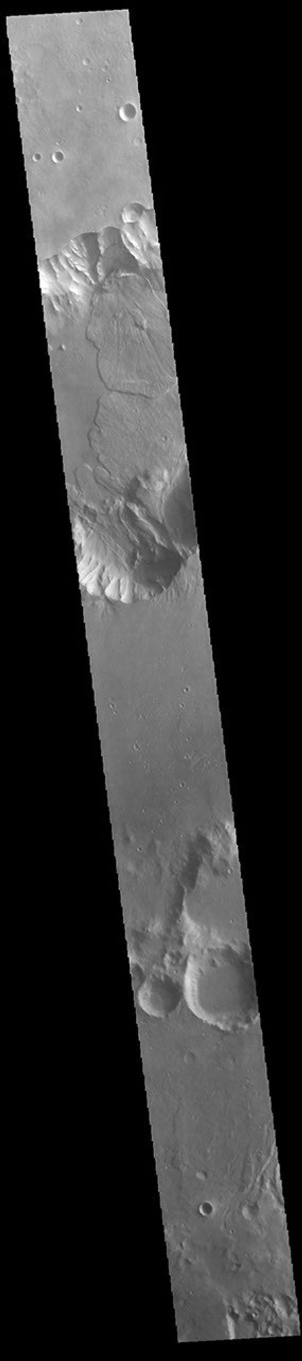 This image from NASA's Mars Odyssey shows a small section of Capri Chasma. Landslide deposits dominate this part of Capri Chasma.