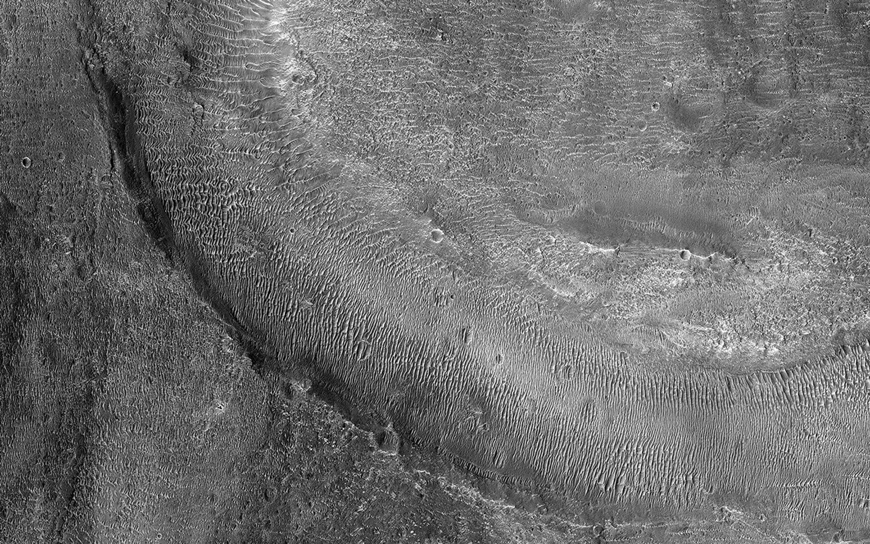 This image acquired on May 10, 2022 by NASA's Mars Reconnaissance Orbiter shows fluvial channels that cut through the ejecta from Jones Crater, indicating relatively younger water activity in the region.