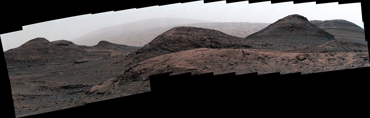 NASA's Curiosity Mars rover captured this image of the sulfate-bearing region and upper Mount Sharp in a dust haze on May 26, 2022.