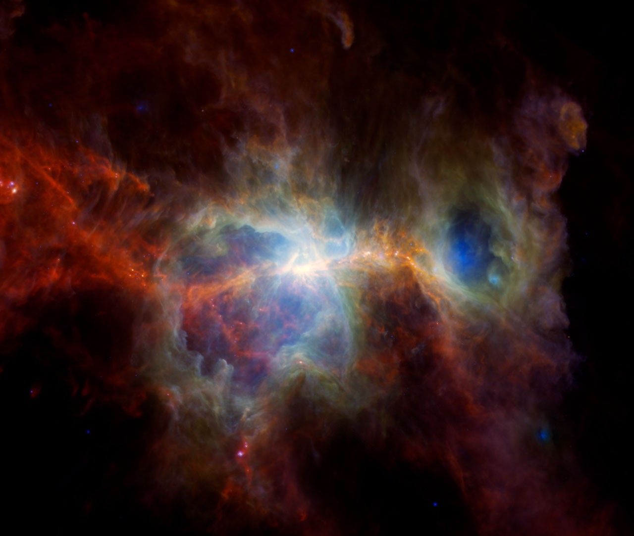 This infrared image of the Orion Nebula features plenty of dust but no stars. In these infrared wavelengths, it's possible to see hot spots where new stars are forming, while unseen bright, massive stars have carved out caverns of empty space.