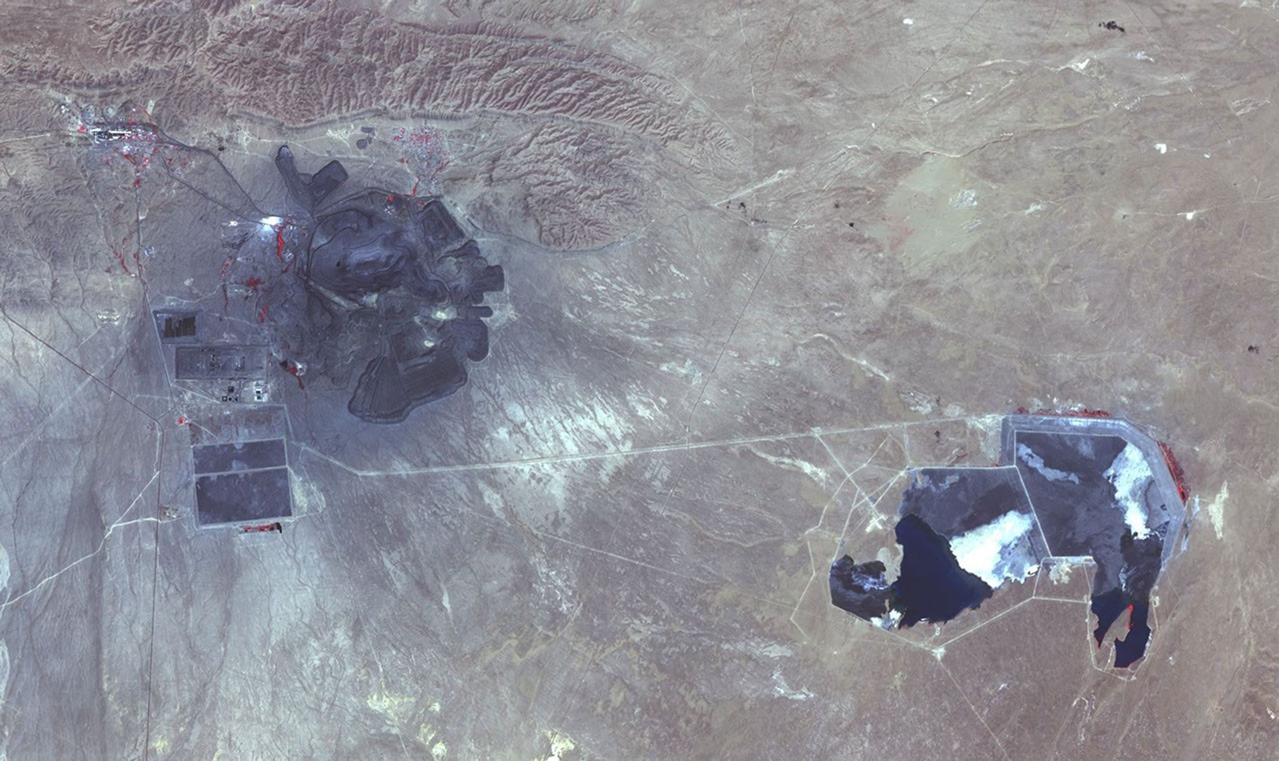 NASA's Terra spacecraft shows the Muruntau gold mine, located in the Qizilqum Desert of Uzbekistan. It is the largest gold mine in the world in terms of production.