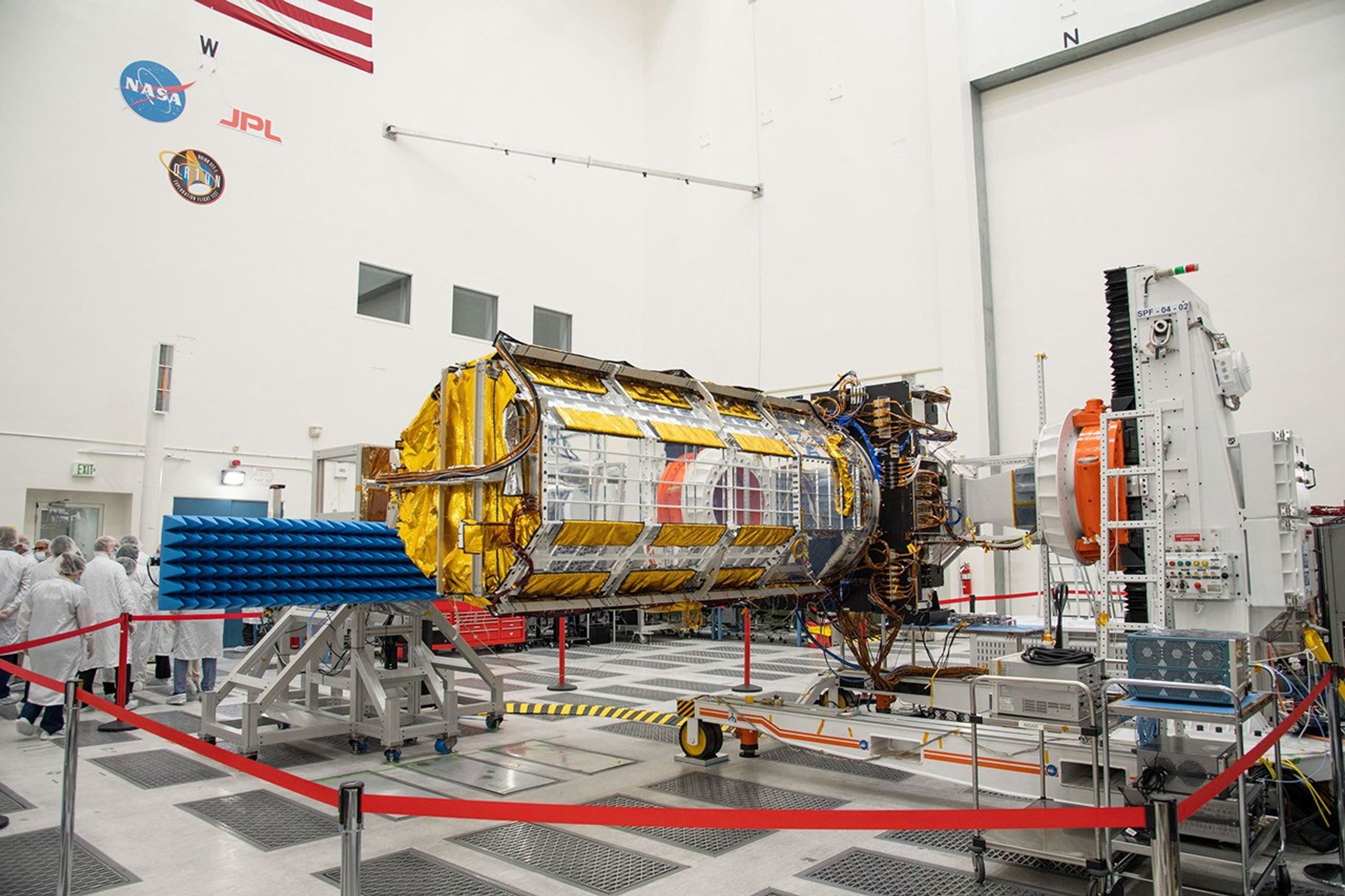 Officials from NASA, ISRO, and the Indian Embassy visit a JPL clean room to view the scientific instrument payload for the NISAR mission.