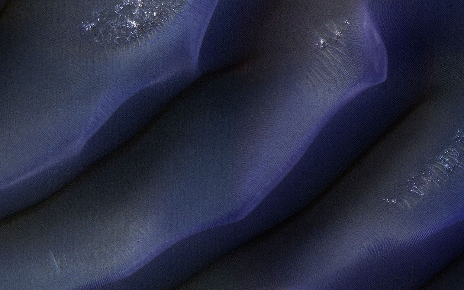 This image acquired on October 23, 2022 by NASA's Mars Reconnaissance Orbiter shows a dune field, located along the western margin of Hellas Planitia, the floor of a giant depression in the Southern Hemisphere of Mars.