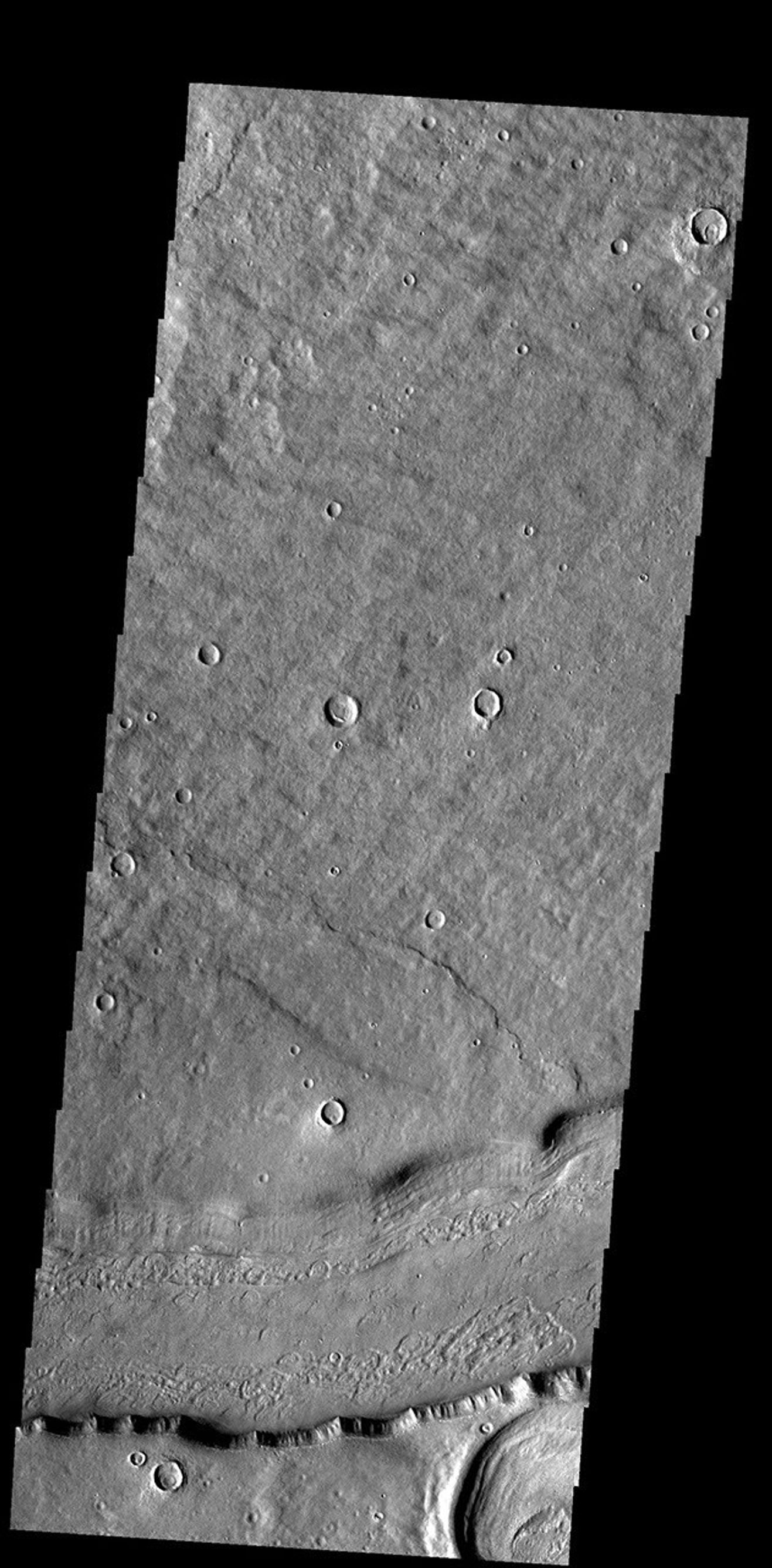 This image from NASA's Mars Odyssey shows a short section of Reull Vallis. Reull Vallis starts in Promethei Terra and empties into Hellas Plainitia.