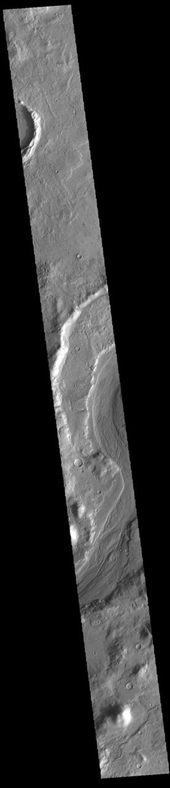This image from NASA's Mars Odyssey shows a short section of Reull Vallis. Reull Vallis starts in Promethei Terra and empties into Hellas Plainitia.