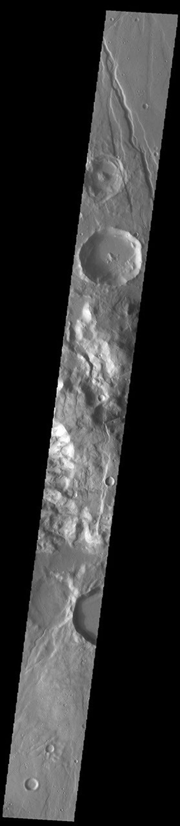 This image from NASA's Mars Odyssey shows Claritas Fossae, a graben filled highland located between the lava plains of Daedalia Planum and Solis Planum.