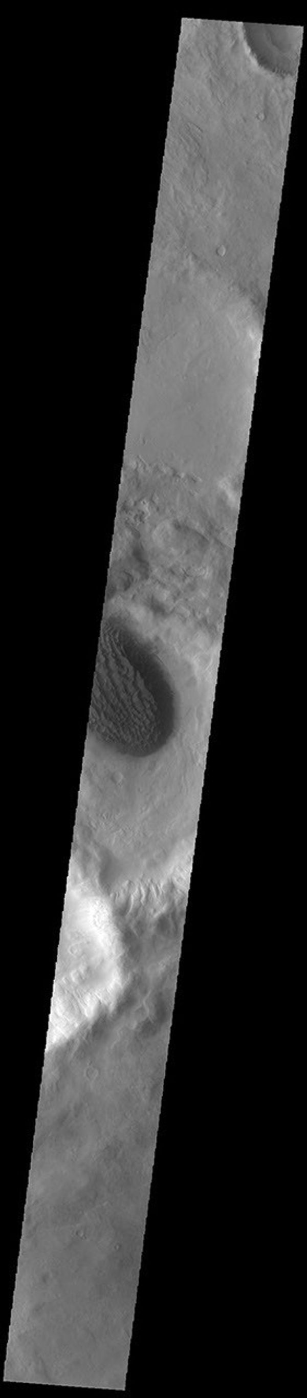 This image from NASA's Mars Odyssey shows Matara Crater, with a large sand deposit on its floor.
