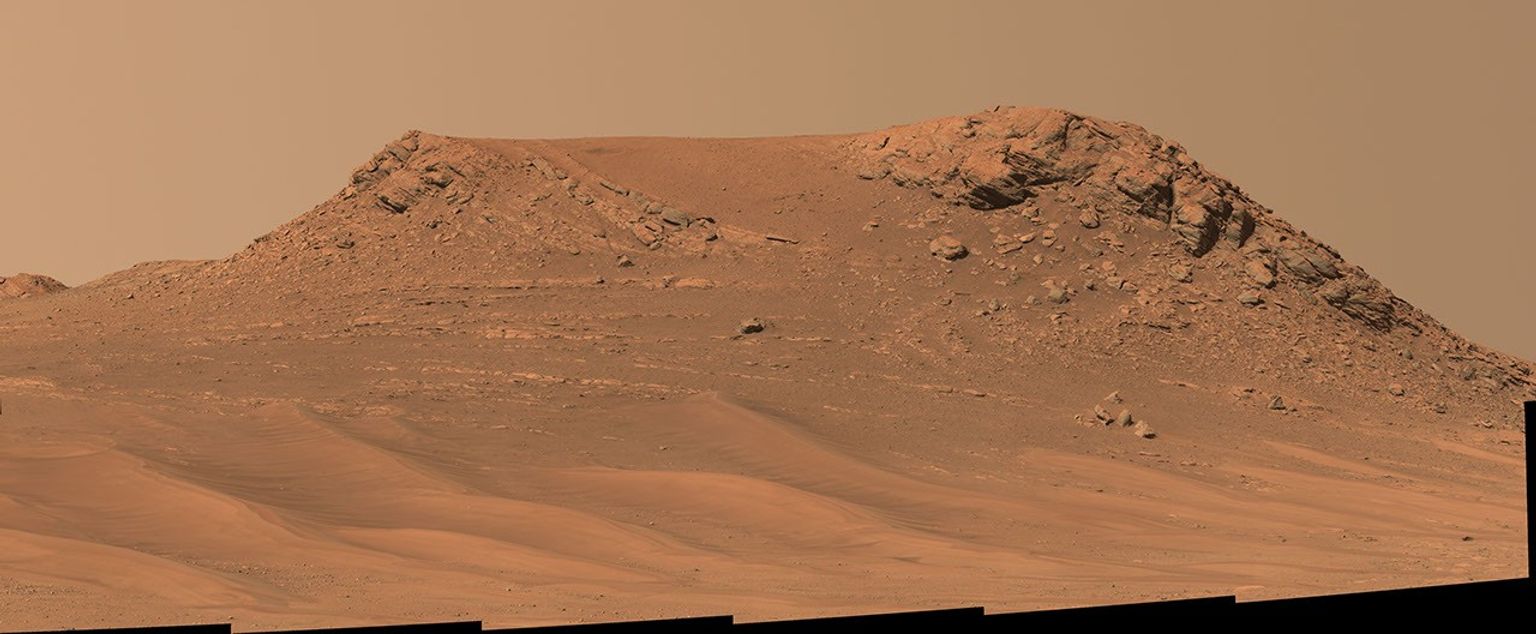 NASA's Perseverance Mars rover captured this mosaic of a hill nicknamed Pinestand. Scientists think the tall sedimentary layers stacked on top of one another here could have been formed by a deep, fast-moving river.