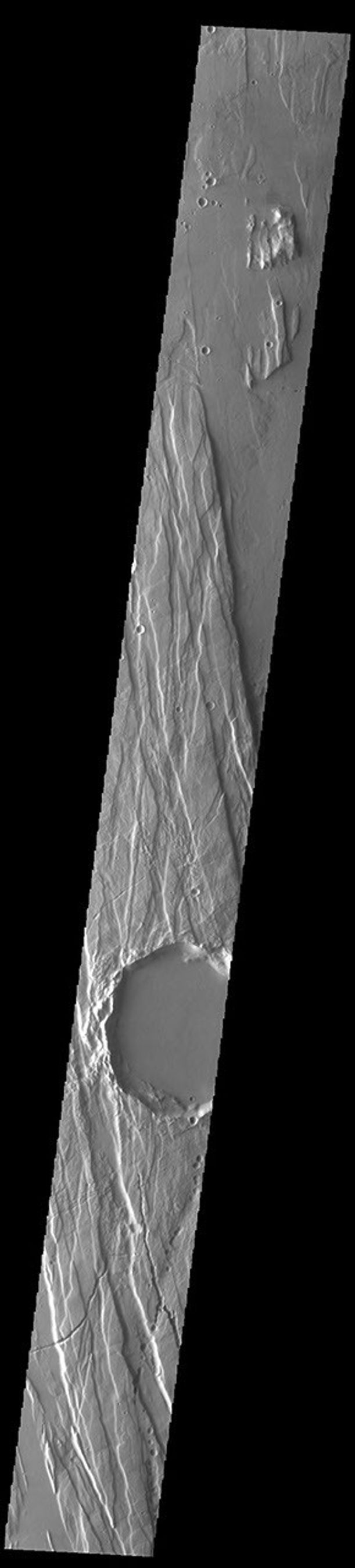This image from NASA's Mars Odyssey shows part of Cerunius Fossae. The linear depressions are fault bounded features called graben.
