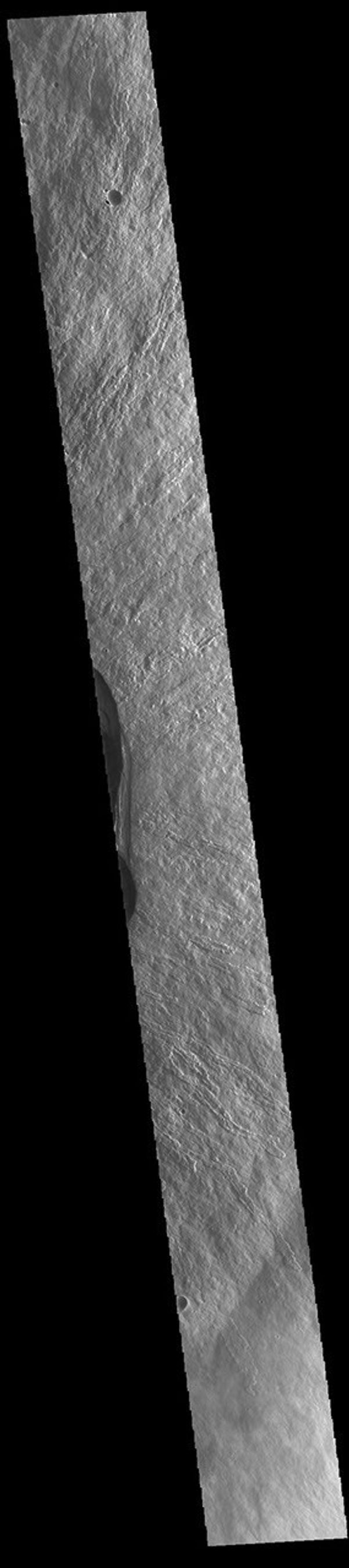 This image from NASA's Mars Odyssey shows part of the summit of Ascraeus Mons. Ascraeus Mons is the northernmost and tallest of the three large aligned Tharsis volcanoes.
