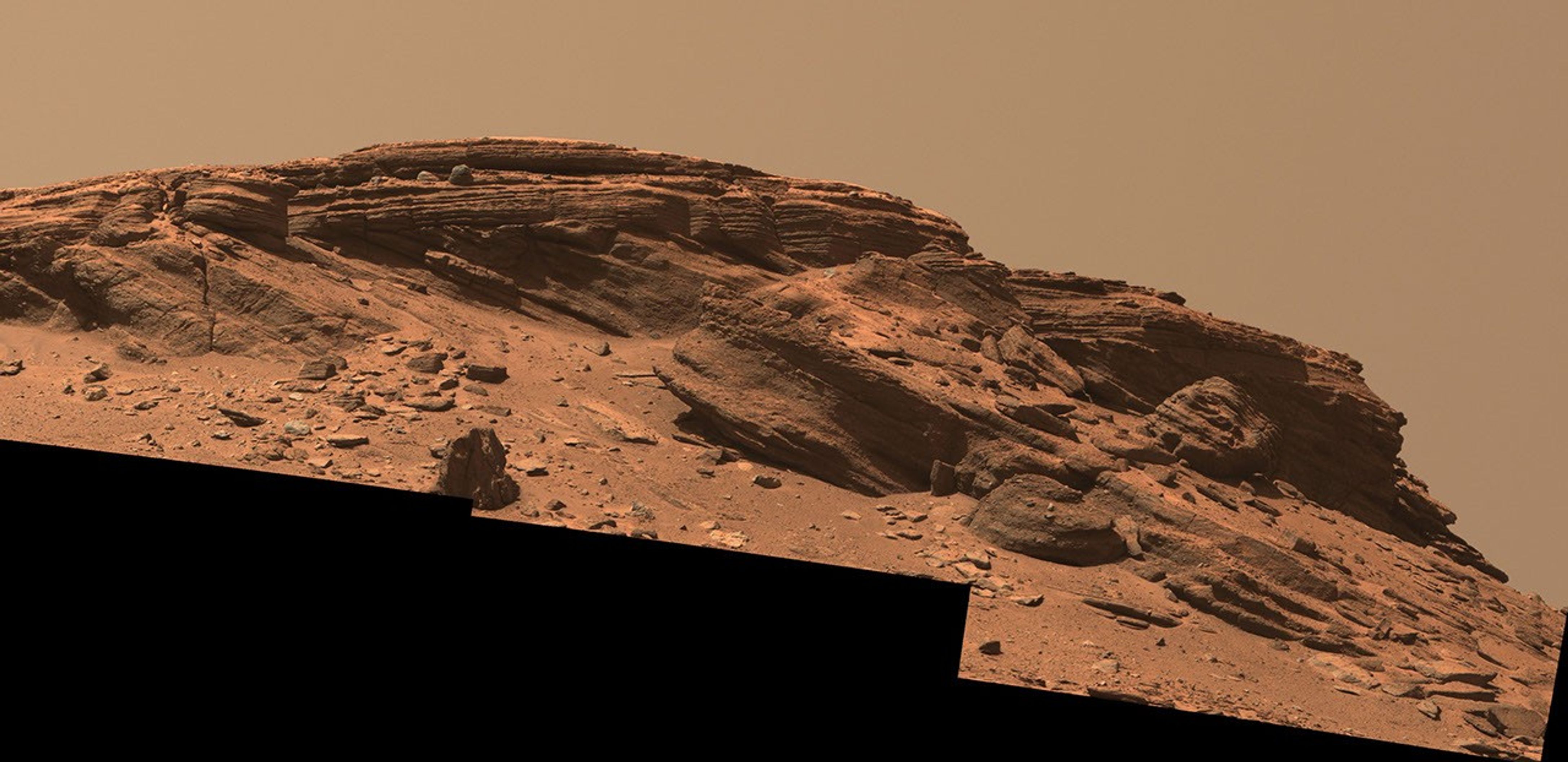 Sedimentary layers at Franklin Cliffs are displayed in a mosaic captured by NASA's Perseverance Mars rover using its Mastcam-Z camera on Feb. 12, 2023, the 704th Martian day, or sol, of the mission.