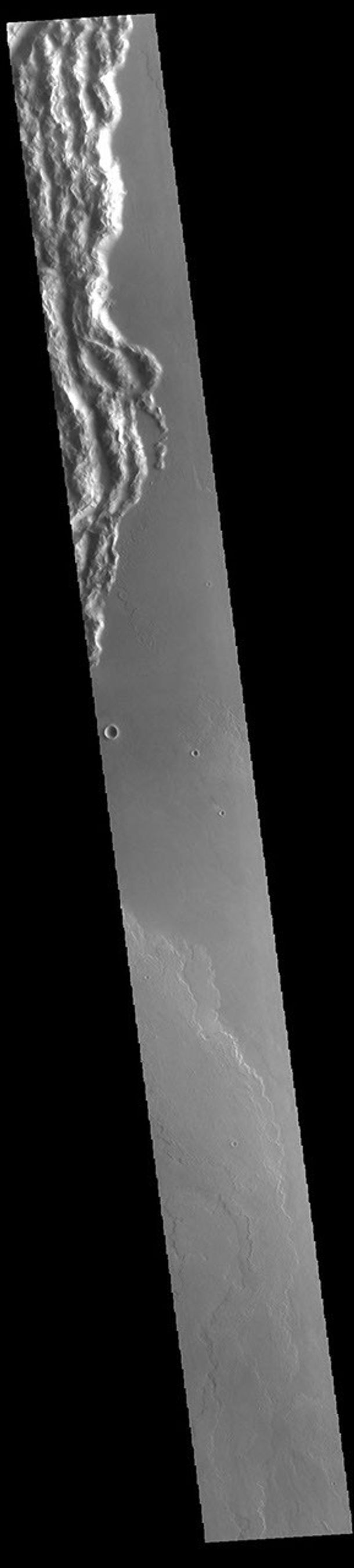 This image from NASA's Mars Odyssey shows a portion of Cyane Sulci. Located to the northeast of Olympus Mons, Cyane Sulci is a complexly fractured region of material inundated on its margins by volcanic flows.