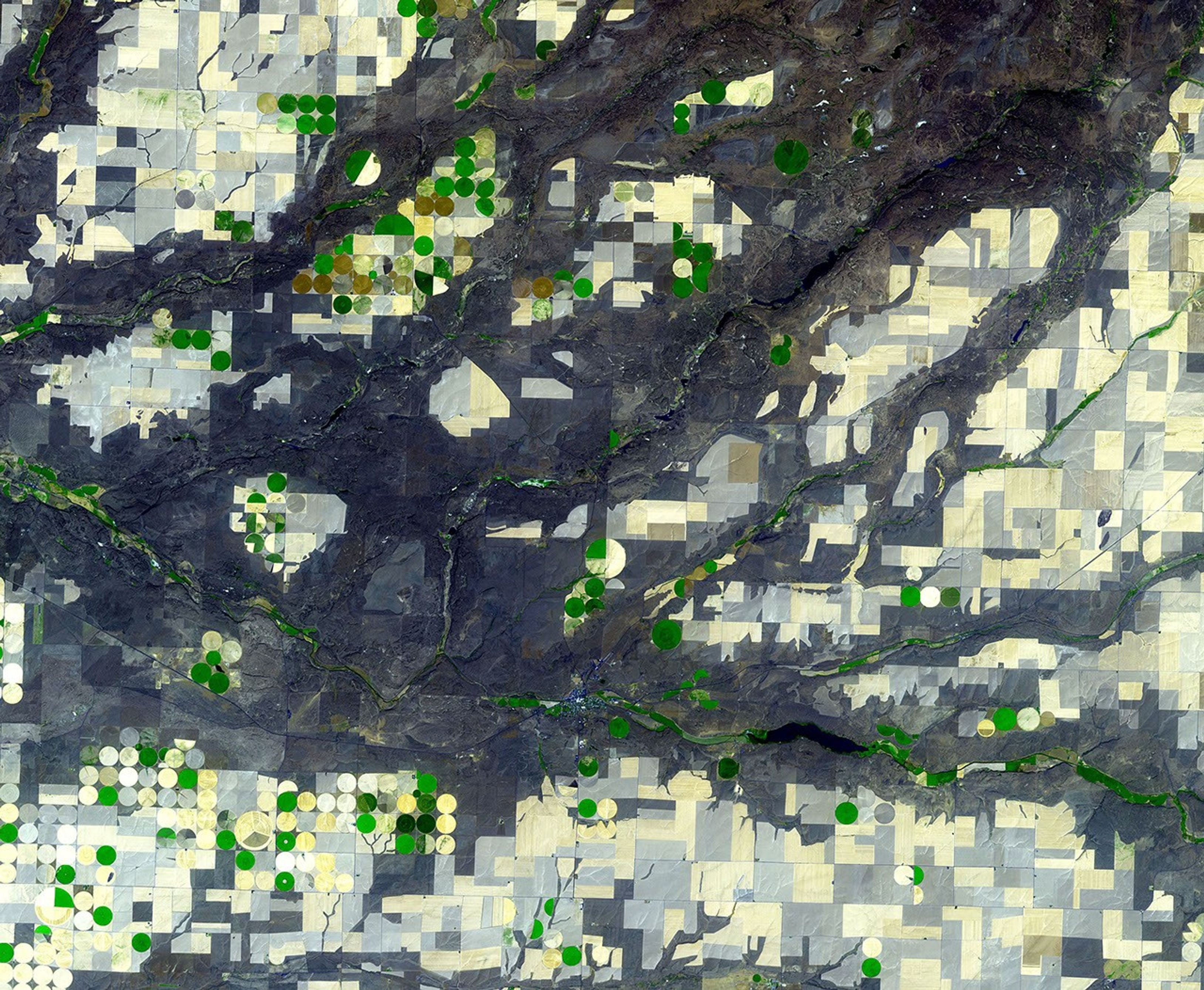 NASA's Terra spacecraft shows the Channeled Scablands in Washington, formed about 19,000 years ago when glacial Lake Missoula in Montana burst through its ice dam, and a 320 m deep lake emptied in a catastrophic flood that reached the Pacific Ocean.