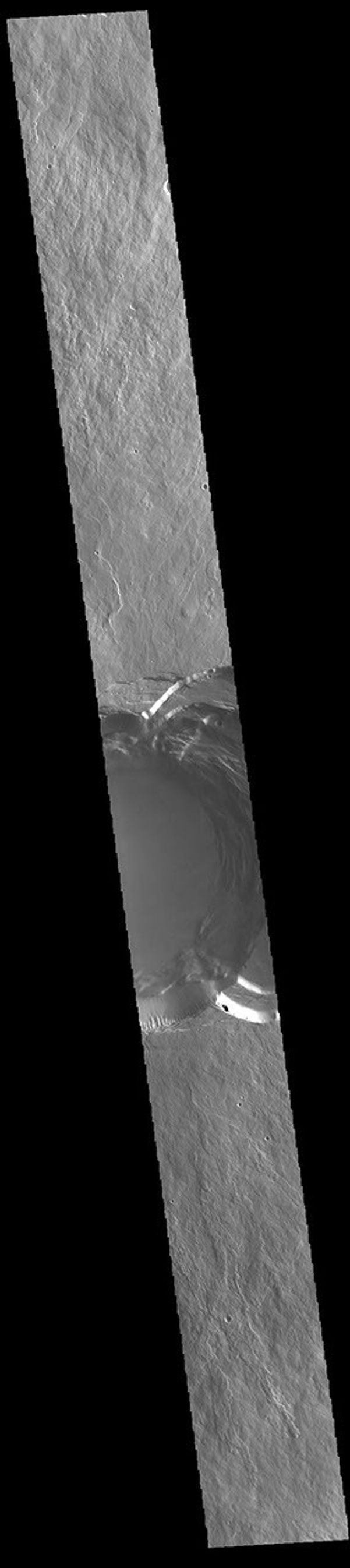 This image from NASA's Mars Odyssey shows part of the summit of Ascraeus Mons. Ascraeus Mons is the northernmost and tallest of the three large aligned Tharsis volcanoes.