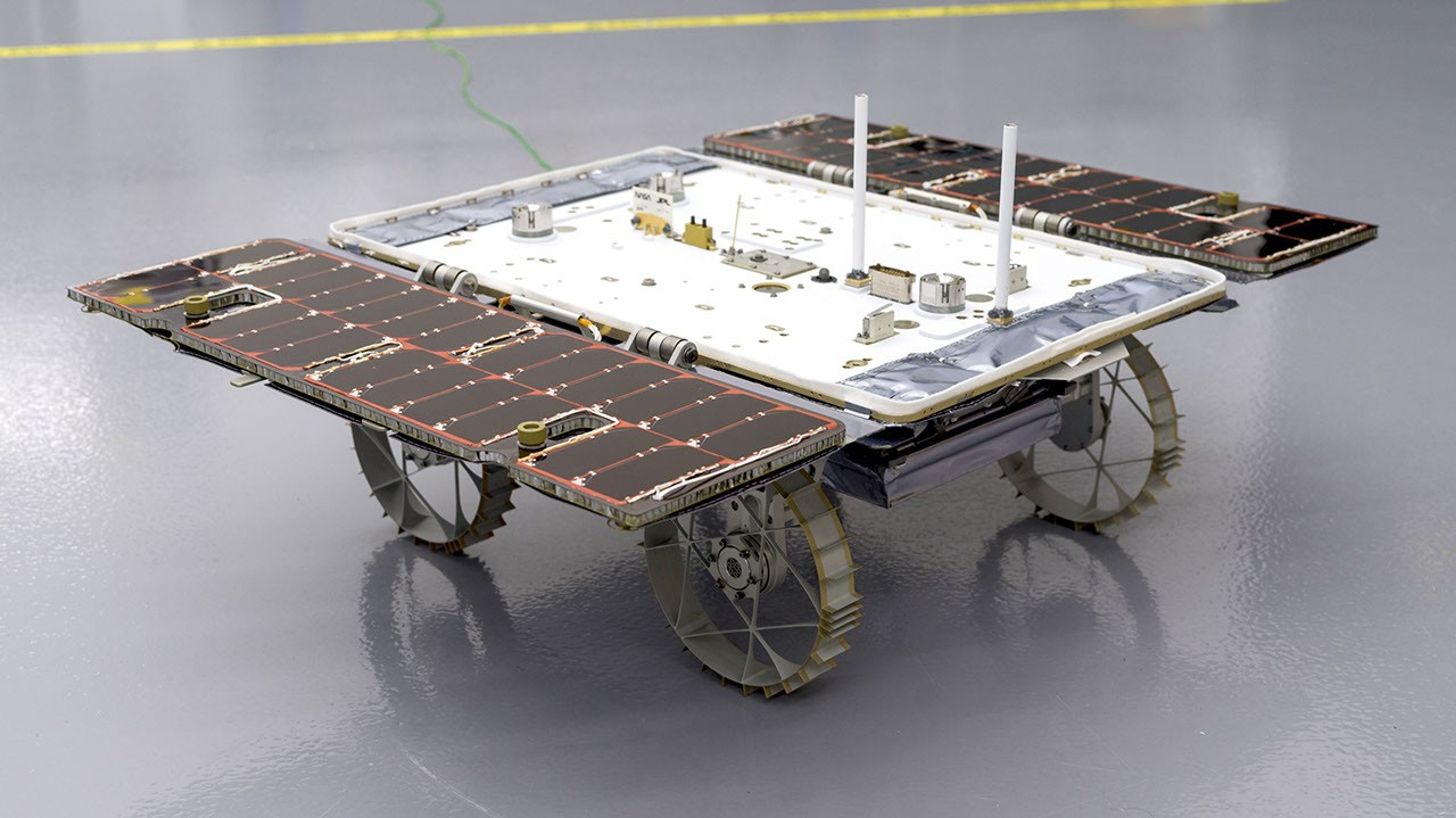 With its solar panels open, a small rover that is bound for the Moon sits in a clean room at NASA's Jet Propulsion Laboratory in Southern California on Jan. 26, 2024.