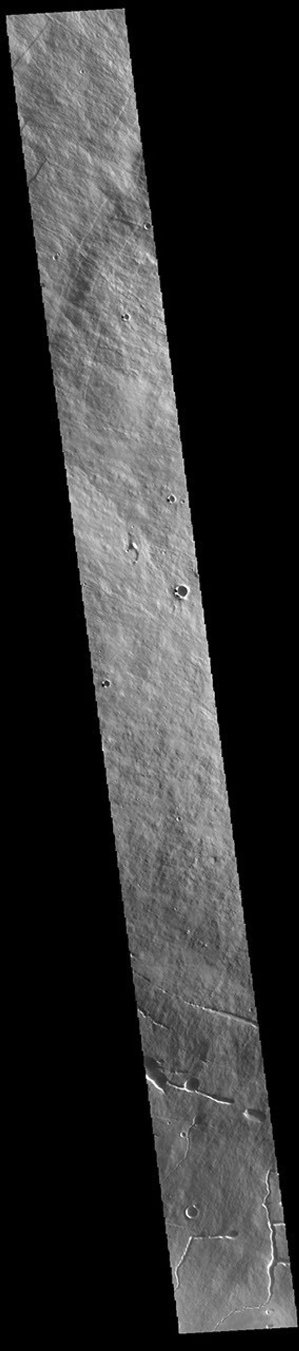 This image from NASA's Mars Odyssey shows a cross section of Pavonis Mons. Pavonis Mons is the central volcano of the three large Tharsis volcanoes.