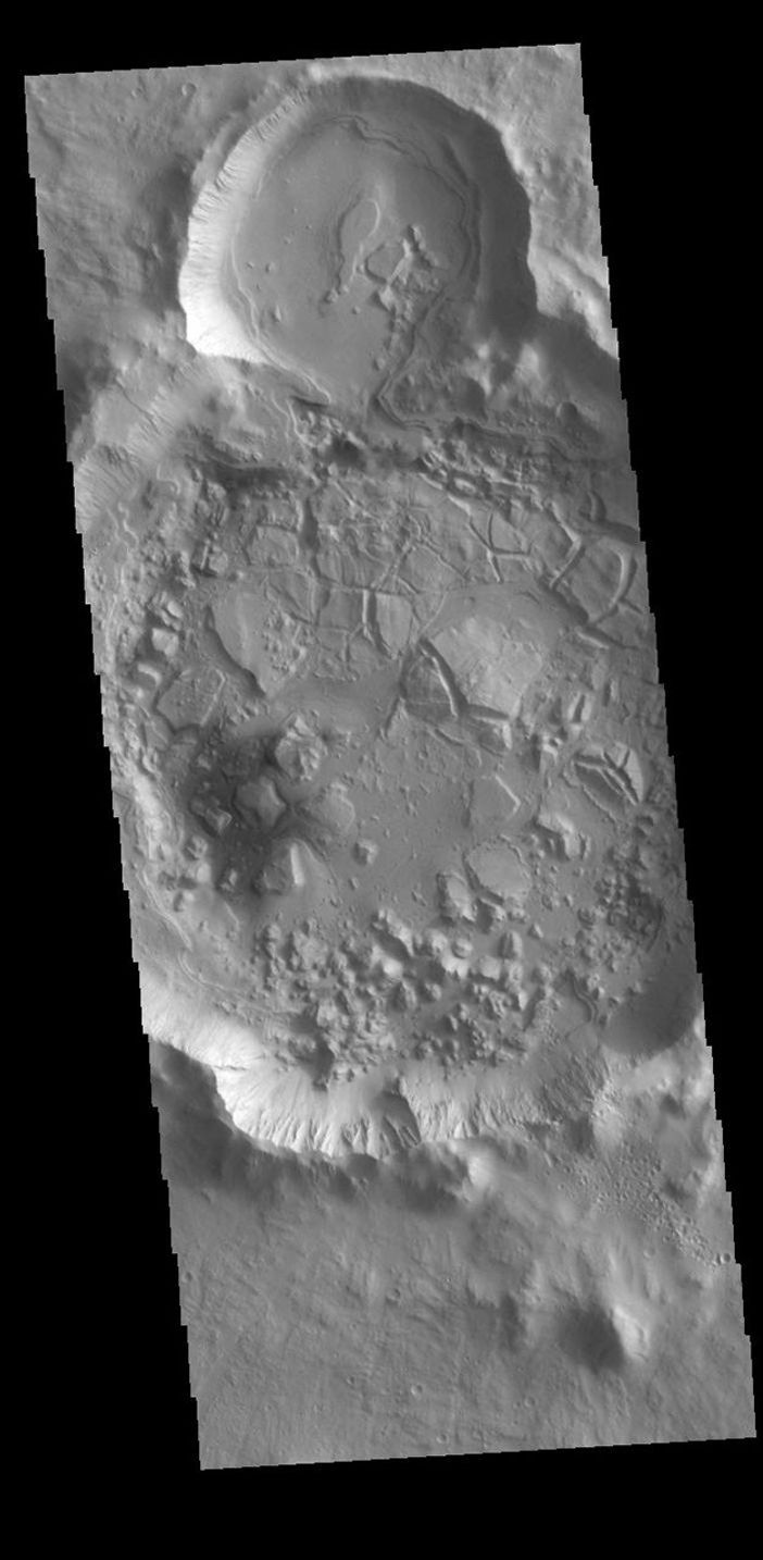 This image from NASA's Mars Odyssey shows an unnamed crater in Tartarus Colles.